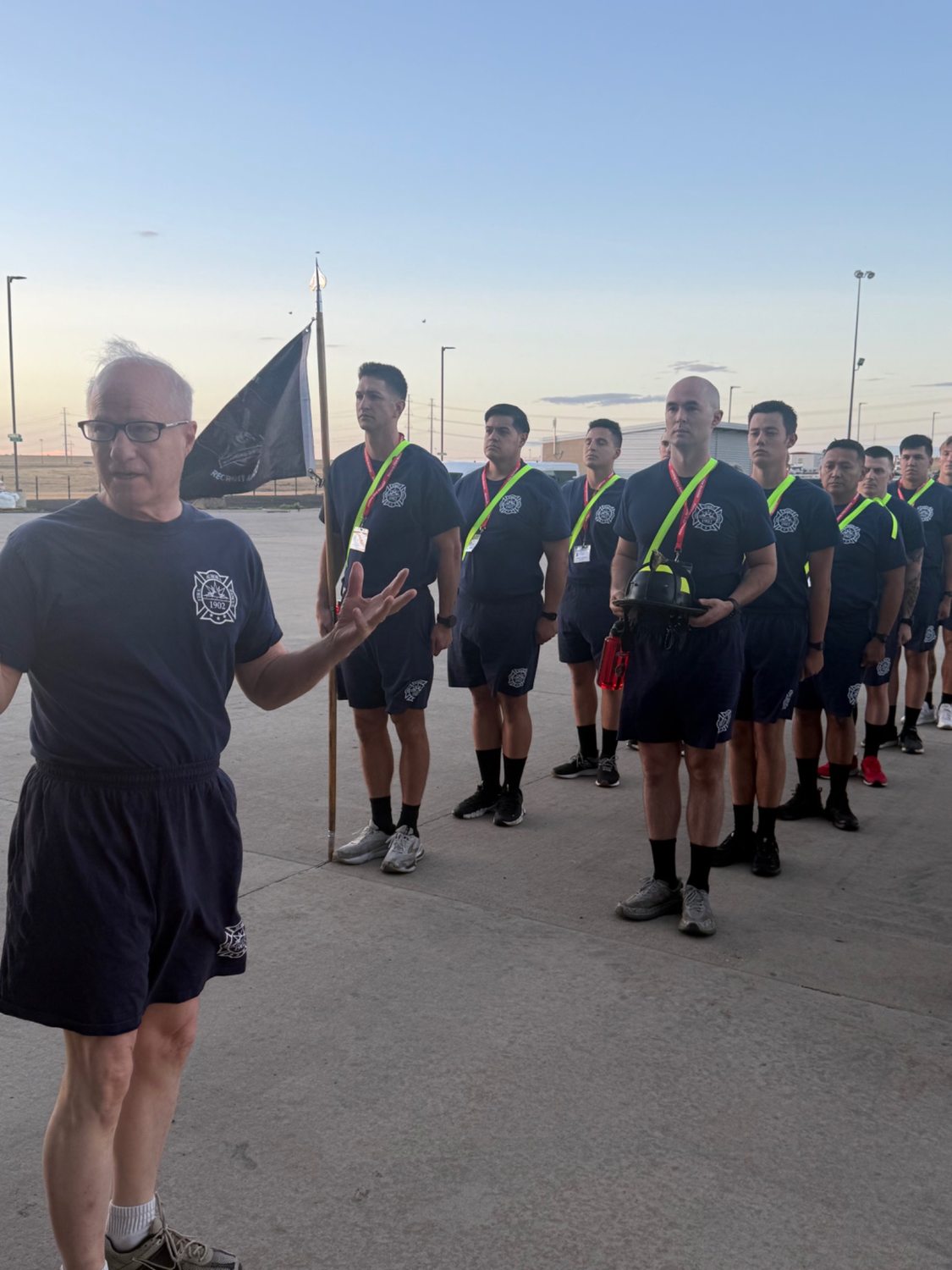 Aurora Fire Rescue recruits stand in formation during instruction